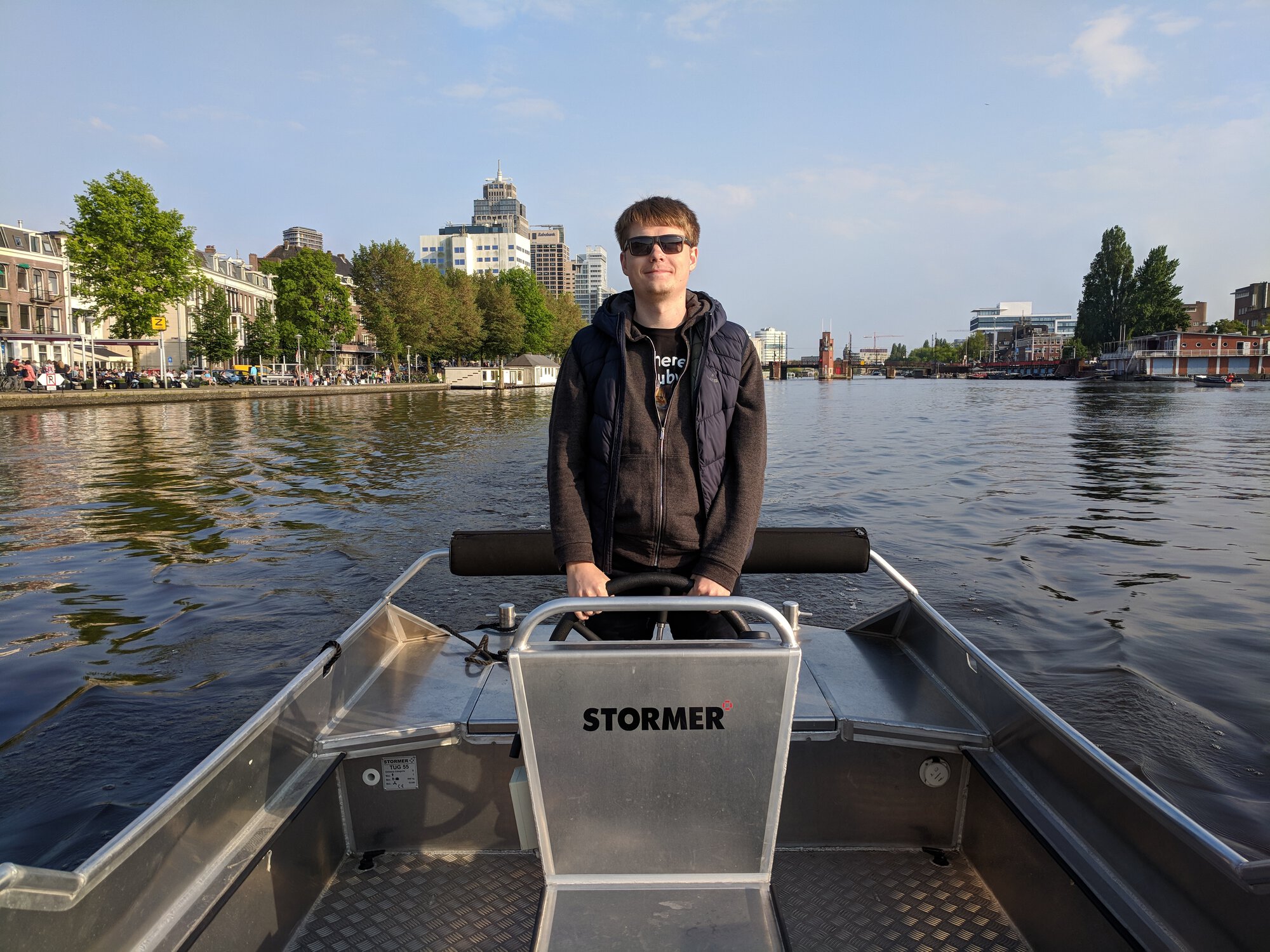 Dima driving a boat