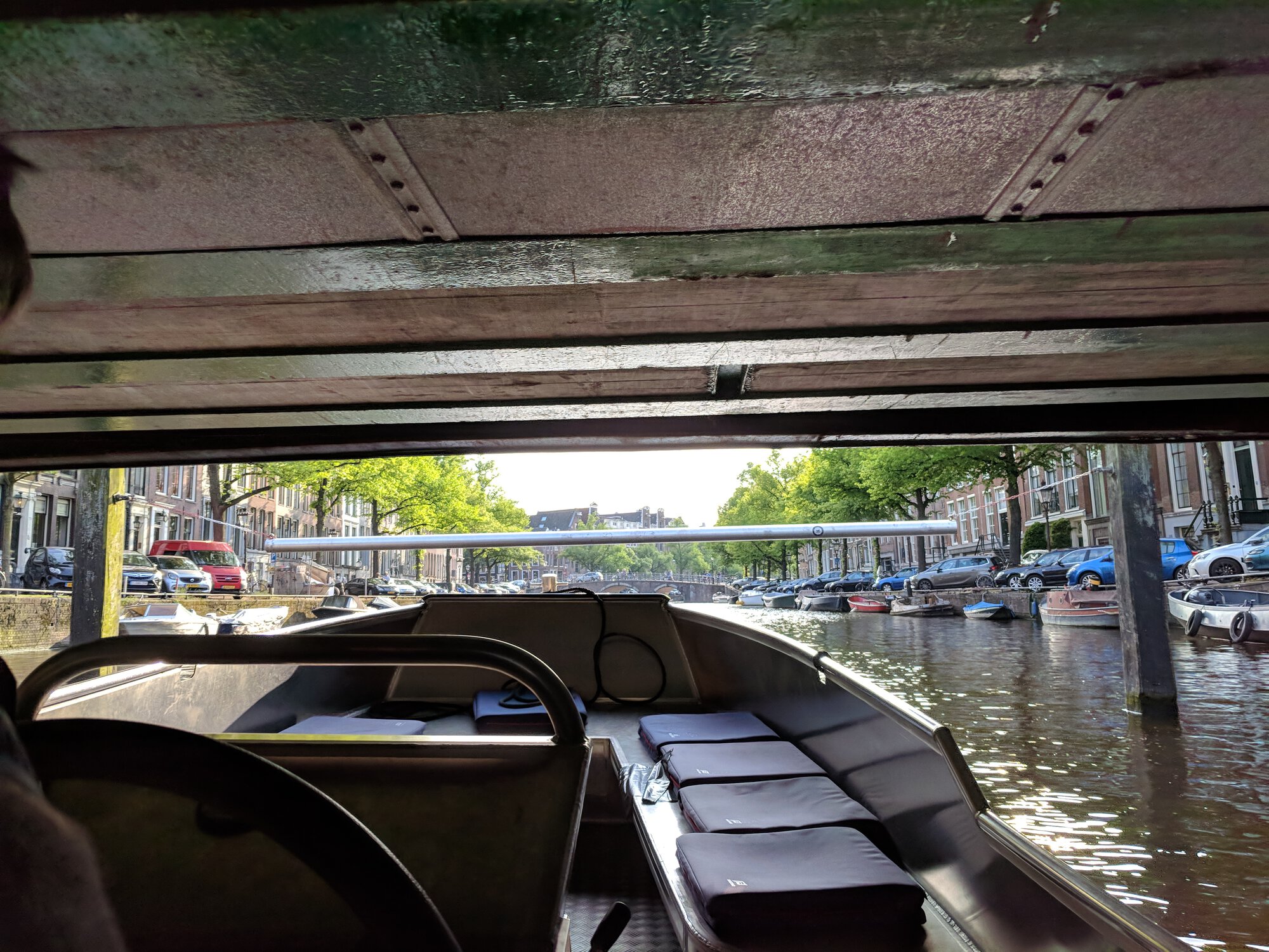 A boat under the pretty low bridge