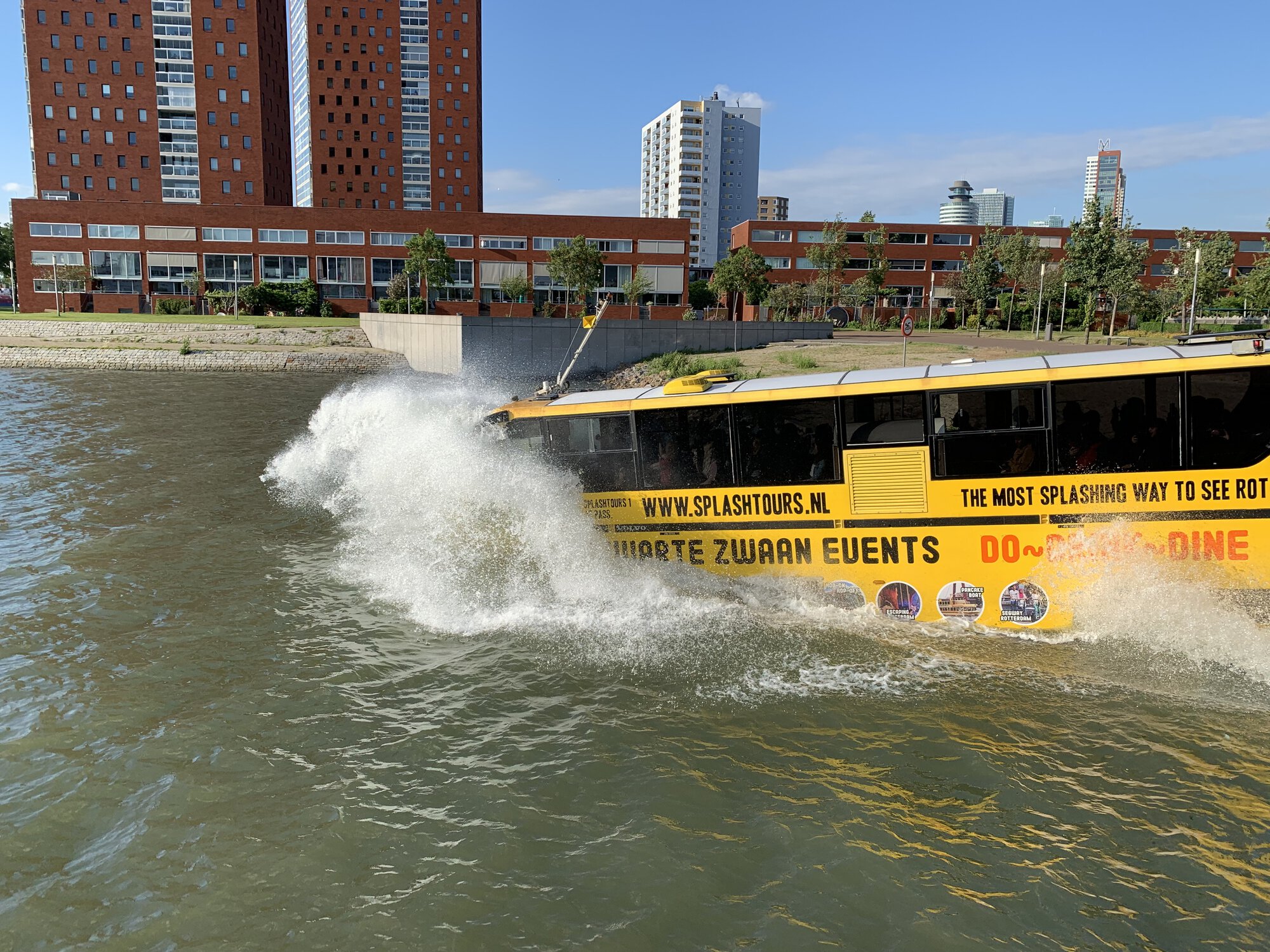 Special amphibia bus drives right into the water and start swimming