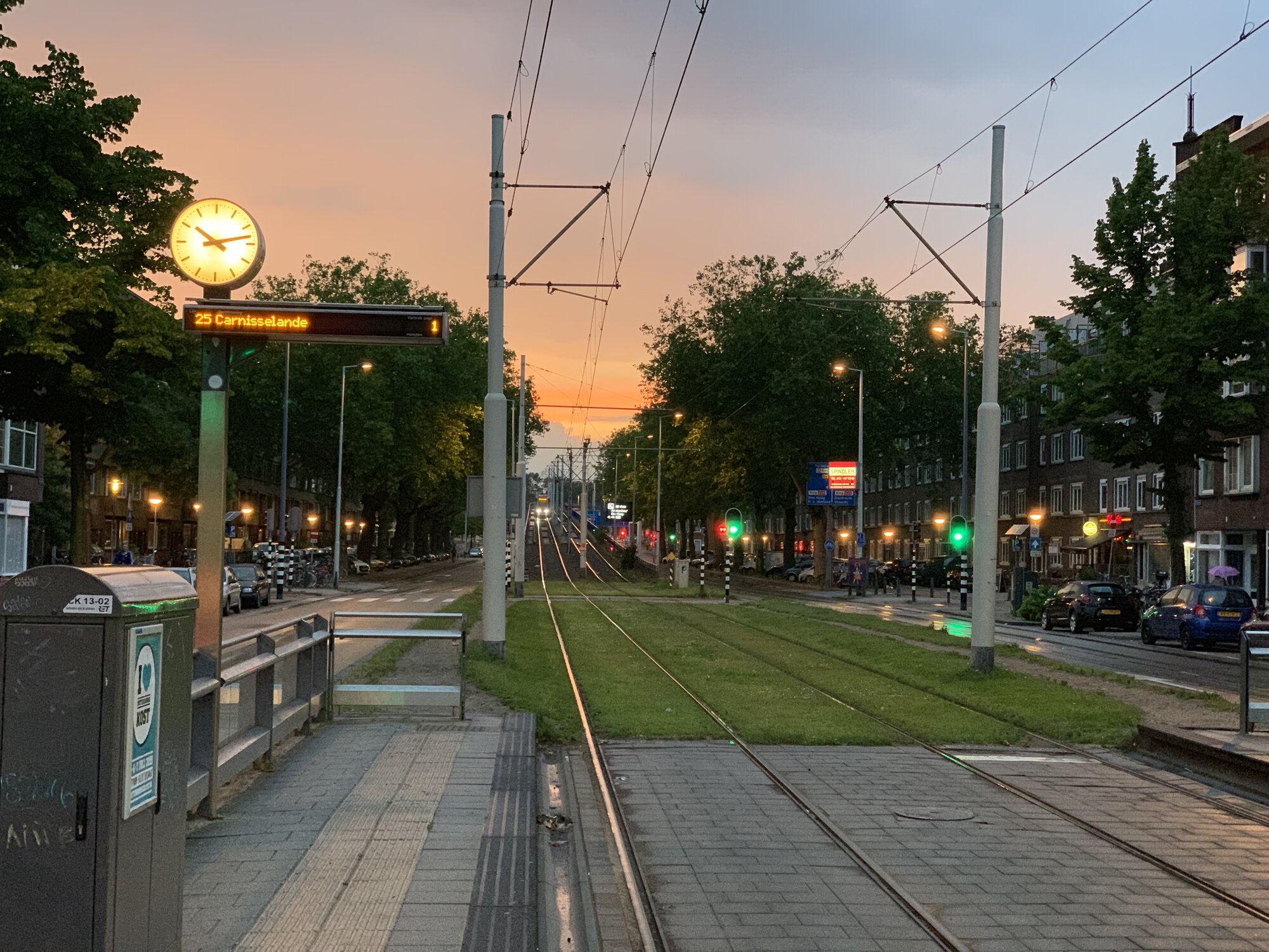 Tram rails, a tram on background, sunset